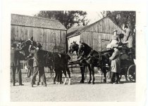 1916 Coaching Trip Stopped in Front of Wooden Buildings